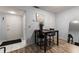 Dining room with wood floors features a dark wood table and views of front door at 19029 Us Highway 19 N # 5-16, Clearwater, FL 33764