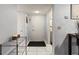 View of the entryway with white tile floors leading to the living areas at 19029 Us Highway 19 N # 5-16, Clearwater, FL 33764