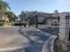 Elegant gated entrance to a residential community with manicured landscaping at 19029 Us Highway 19 N # 5-16, Clearwater, FL 33764