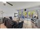 Relaxing living room boasts a ceiling fan, wood floors and sliding glass doors at 19029 Us Highway 19 N # 5-16, Clearwater, FL 33764