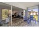 Enclosed porch with wood floors and sliding glass doors showcases view to the living room at 19029 Us Highway 19 N # 5-16, Clearwater, FL 33764