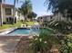 Charming water feature nestled in green space between condo buildings and lush foliage at 19029 Us Highway 19 N # 5-16, Clearwater, FL 33764