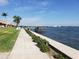 Scenic waterfront view with a private dock and lush landscaping in a desirable community at 19029 Us Highway 19 N # 5-16, Clearwater, FL 33764