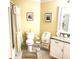 Well-lit bathroom features a white vanity with granite counters and shower-tub combo at 19420 Haskell Pl, Land O Lakes, FL 34638