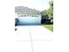 Charming single-story home featuring an attached two-car garage and a well-maintained front yard at 19420 Haskell Pl, Land O Lakes, FL 34638