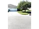 Charming home featuring a well-maintained two-car garage and extended driveway with lush lawn at 19420 Haskell Pl, Land O Lakes, FL 34638