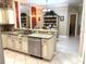 A spacious kitchen features granite countertops, stainless steel appliances, and modern fixtures at 19420 Haskell Pl, Land O Lakes, FL 34638