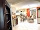 Bright, open-concept living room flows into a modern kitchen with island seating at 19420 Haskell Pl, Land O Lakes, FL 34638