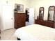 Spacious main bedroom featuring wood furniture and tiled floors at 19420 Haskell Pl, Land O Lakes, FL 34638