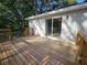 Back deck with wood railings overlooking a partially shaded lot at 21033 Market St, Dade City, FL 33523