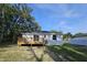 Backyard view of the back deck and home at 21033 Market St, Dade City, FL 33523