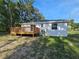 Backyard view of the back deck and home at 21033 Market St, Dade City, FL 33523