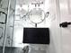 Modern bathroom boasts sleek floating vanity and walk-in shower with elegant marble tile at 21033 Market St, Dade City, FL 33523