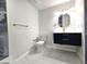 Modern bathroom with floating vanity, gold accents, and marble tile floors at 21033 Market St, Dade City, FL 33523