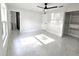 Bedroom featuring bright natural light, ceiling fan, closet and marble tile flooring at 21033 Market St, Dade City, FL 33523