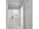 Bright laundry room with marble tile floors and white walls at 21033 Market St, Dade City, FL 33523