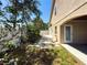 The yard has landscaping and pavers that leads to the house at 2614 Hawk Roost Ct, Holiday, FL 34691