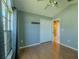 Cozy bedroom featuring a ceiling fan, wood floors, and a closet at 2614 Hawk Roost Ct, Holiday, FL 34691