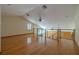 Spacious upper bonus room with hardwood floors, ceiling fans, and natural light at 2614 Hawk Roost Ct, Holiday, FL 34691