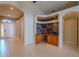 An entryway with tiled floors, and archways, plus a built in hutch at 2614 Hawk Roost Ct, Holiday, FL 34691