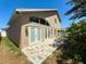 Exterior of a house with multiple windows, and a yard. The home has a clean look and feel at 2614 Hawk Roost Ct, Holiday, FL 34691