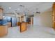 Spacious living room open to kitchen with stainless steel appliances at 2614 Hawk Roost Ct, Holiday, FL 34691