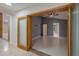 Open living room featuring vaulted ceilings, gray walls, and tile floors at 2614 Hawk Roost Ct, Holiday, FL 34691