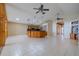 Large living space that has tile flooring and is open to the kitchen at 2614 Hawk Roost Ct, Holiday, FL 34691