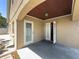 Covered patio with neutral color, offering a nice, relaxing outdoor area at 2614 Hawk Roost Ct, Holiday, FL 34691