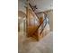 Unique staircase with wood and glass elements in an open layout at 2614 Hawk Roost Ct, Holiday, FL 34691