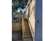 Backyard view features newly constructed wooden staircase leading to a second-story entrance at 2745 4Th S Ave, St Petersburg, FL 33712