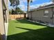 Well-maintained backyard with artificial turf, landscaping, and privacy fence, offering a serene retreat at 2745 4Th S Ave, St Petersburg, FL 33712