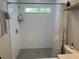 Well-lit shower with tiled walls and a modern shower head with shelf inset at 2745 4Th S Ave, St Petersburg, FL 33712