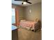 A bedroom features soft lighting, a charming bed, and light pink accents at 2745 4Th S Ave, St Petersburg, FL 33712