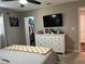 Comfortable bedroom featuring a TV, dresser, and walk-in closet at 2745 4Th S Ave, St Petersburg, FL 33712