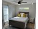 Bedroom with natural light, ceiling fan, wood floors, and neutral tones create a calming atmosphere at 2745 4Th S Ave, St Petersburg, FL 33712
