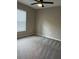 Neutral bedroom with soft carpet, ceiling fan, and natural lighting at 2745 4Th S Ave, St Petersburg, FL 33712