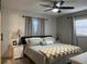 Cozy bedroom with ceiling fan, plush bedding, and neutral-toned decor at 2745 4Th S Ave, St Petersburg, FL 33712
