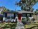 Charming single-story home featuring a bright red front door and well-maintained landscaping at 2745 4Th S Ave, St Petersburg, FL 33712
