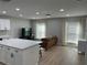 Open concept with kitchen island view into living room featuring hardwood floors, recessed lighting, and large windows at 2745 4Th S Ave, St Petersburg, FL 33712