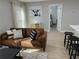 Bright living room features modern decor, wood floors and comfortable seating with natural light at 2745 4Th S Ave, St Petersburg, FL 33712
