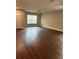 Open living room with hardwood flooring and a neutral color scheme, providing a spacious and inviting feel at 2745 4Th S Ave, St Petersburg, FL 33712