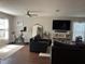 Comfortable living room featuring a stationary bike, modern furniture, and hardwood floors at 2745 4Th S Ave, St Petersburg, FL 33712