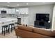 Open floor plan view of living room flowing into kitchen with island and bar stool seating at 2745 4Th S Ave, St Petersburg, FL 33712