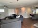Open-concept living room with hardwood floors seamlessly connecting to kitchen with bar seating at 2745 4Th S Ave, St Petersburg, FL 33712