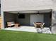 Covered outdoor living space featuring seating, a dining table, a TV, and a fan at 2745 4Th S Ave, St Petersburg, FL 33712