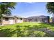 Spacious backyard featuring a large pool enclosure and storage shed at 2818 Cedaridge Dr, Tampa, FL 33618