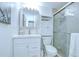 Clean, modern bathroom with white vanity, mirrored cabinet, and a glass-enclosed shower at 2818 Cedaridge Dr, Tampa, FL 33618