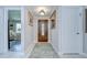 Elegant foyer featuring neutral tones, decorative lighting, and a glimpse into the living area at 2818 Cedaridge Dr, Tampa, FL 33618