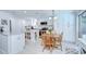 Bright kitchen featuring white cabinets, granite countertops, stainless steel appliances, and a central island at 2818 Cedaridge Dr, Tampa, FL 33618